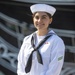 Airman Apprentice Megan Kearns poses for a photo in front of USS Constitution