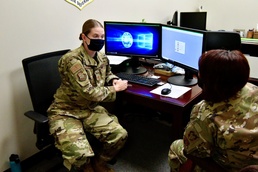 Maj. Danielle Rogowski helps an Airman with a will