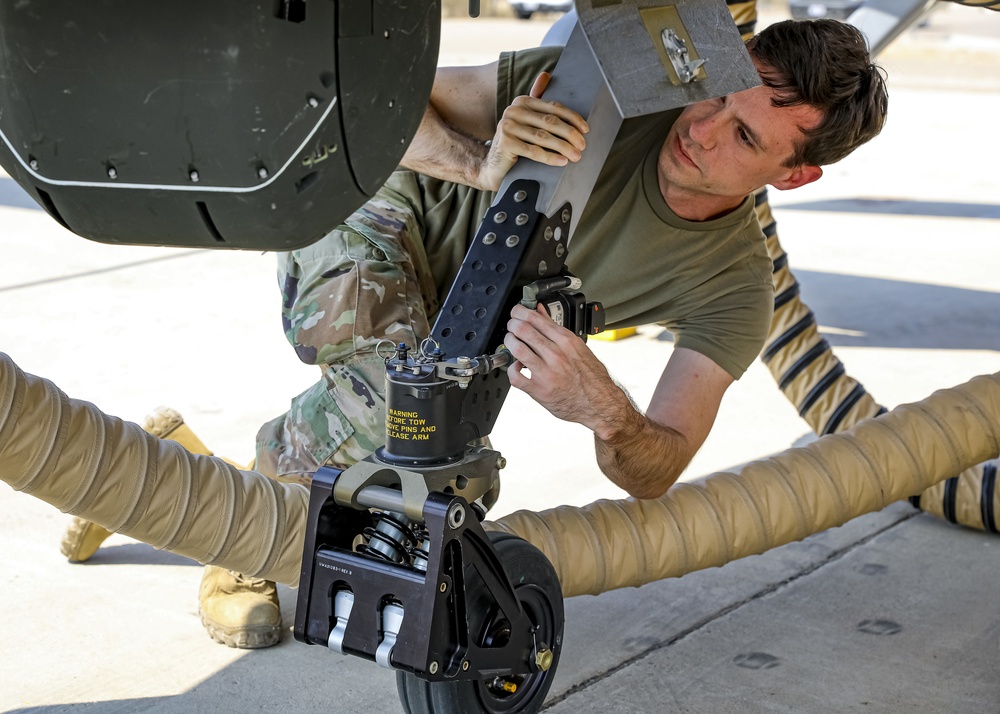 A U.S. Army Soldier, secures landing equiptment on a Grey Eagle autonomous weapons system, during Project Convergence 20, a demonstartion of modernized warfare capabilities, at Yuma Proving Ground, Arizona, September 17, 2020.