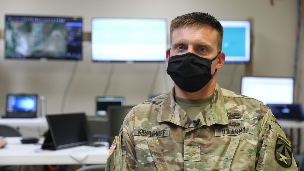 Maj. Stephen Kirchhoff, lead Network Planner, assigned to the U.S. Army Network-Cross Functional Team, participates in an interview, discussing the significance of the Project Convergence 20 demonstration, at Yuma Proving Groun, Arizona.