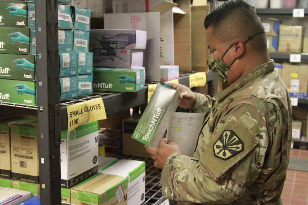 Arizona National Guard Service members help prepare PPE for Mohave County.