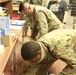 Arizona National Guard Service members help prepare PPE for Mohave County.