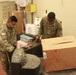 Arizona National Guard Service members help prepare PPE for Mohave County.