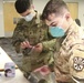 Arizona National Guard Medics give class on PPE to Glendale school district nurses.