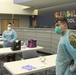 Arizona National Guard Medics give class on PPE to Glendale school district nurses.