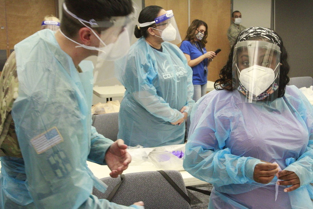 Arizona National Guard Medics give class on PPE to Glendale school district nurses.