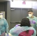 Arizona National Guard Medics give class on PPE to Glendale school district nurses.