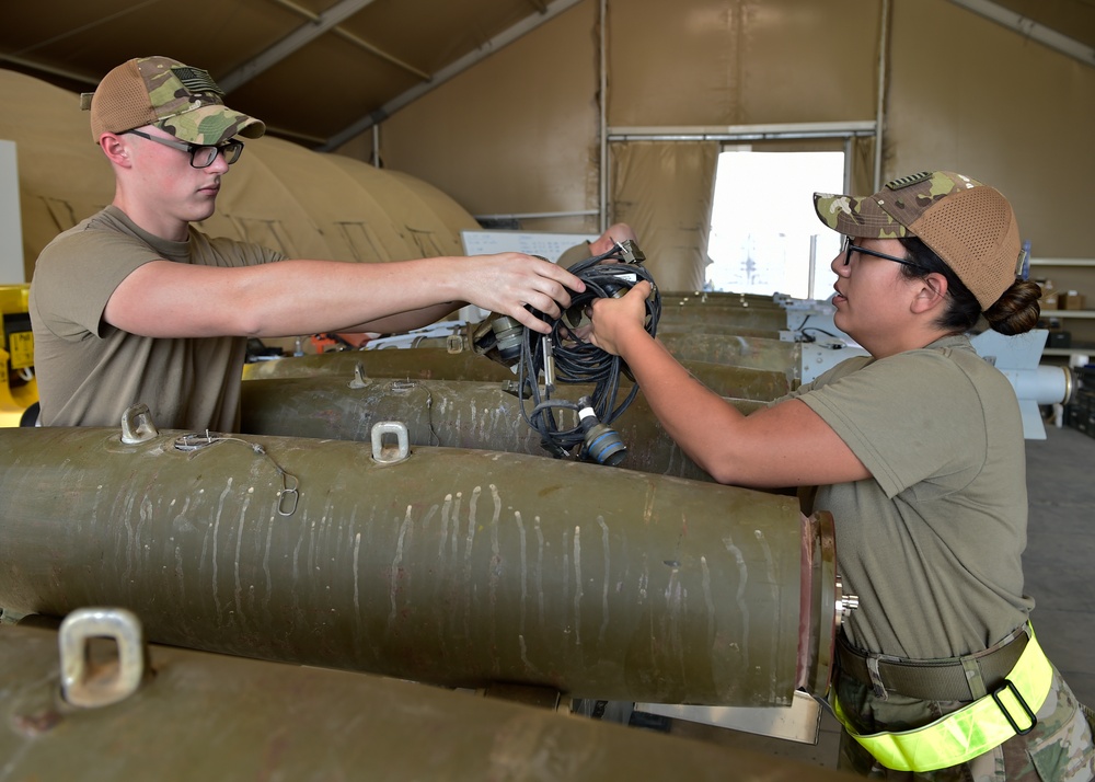 Munitions Airmen build munitions for follow-on forces