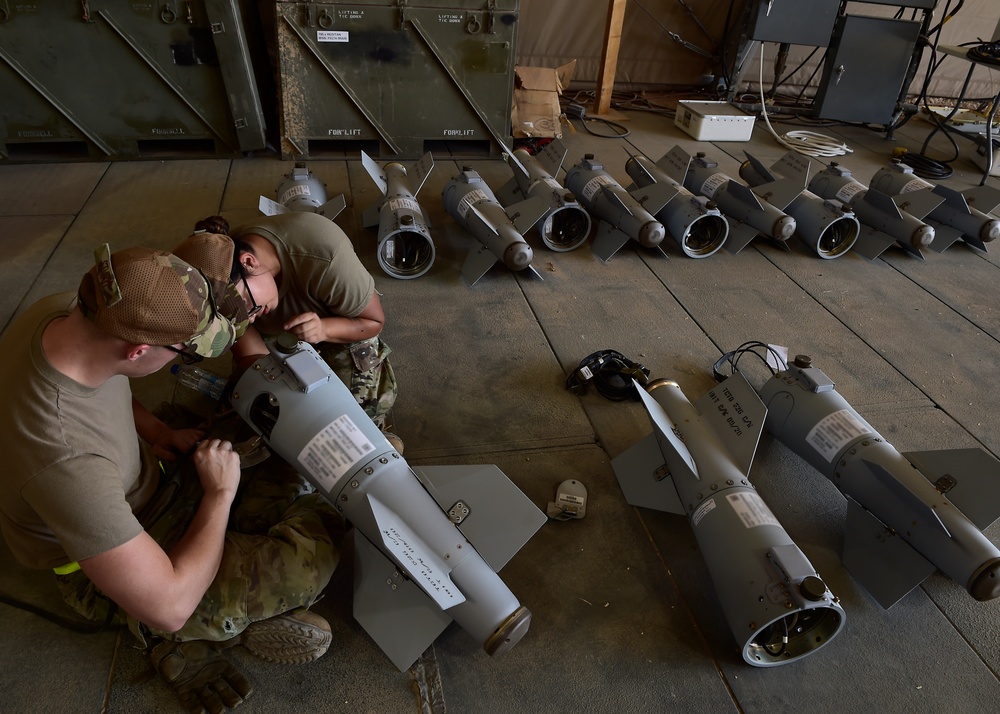 Munitions Airmen build munitions for follow-on forces