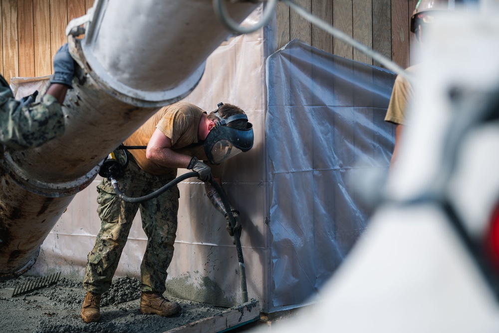 NMCB 3 Pours Concrete in Southwest Asia Huts on Camp Tinian