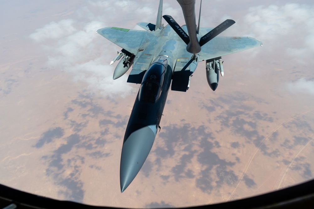 A U.S. Air Force KC-135 Stratotanker refuels F-15C Eagles