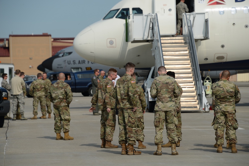 113th Cav Soldiers wait to load bags