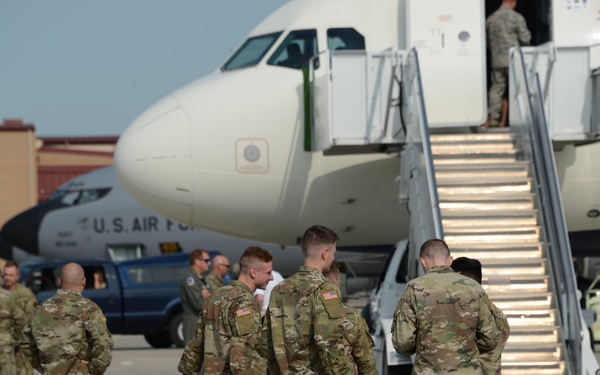113th Cav Soldiers wait to load bags