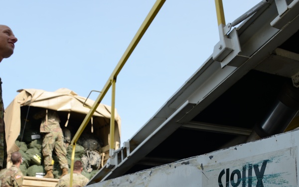 113th Cav Soldiers load bags