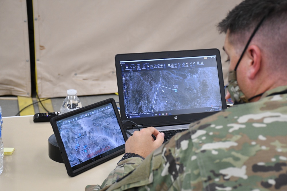 Solider monitors air and ground position location information (PLI) on the Windows Tactical Assault Kit (WINTAK) and Android Tactical Assault Kit (ATAK) to get a common operating picture that enhances situational awareness and data sharing.