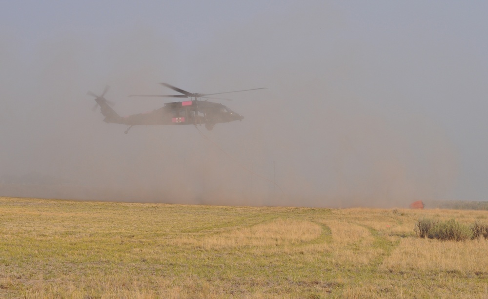 Oregon Guard Black Hawks support water bucket operations on Brattain Fire