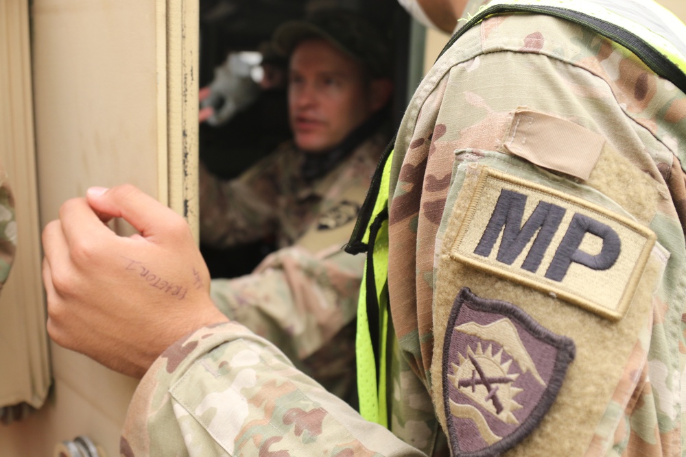 Oregon Army National Guard Soldiers man traffic control points to protect citizens from fire hazards