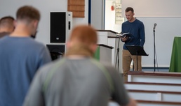 Chaplain Arrington reads scriptures