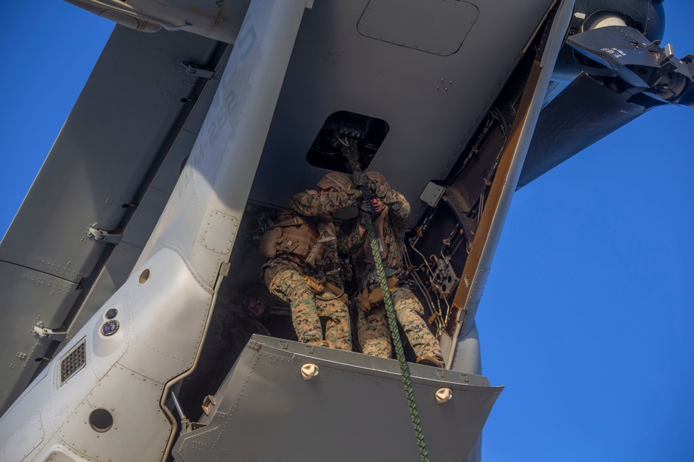 Marines and Sailors Fast Rope aboard USS America