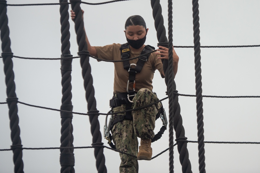 Sailors climb the shrouds aboard USS Constitution
