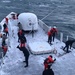 Coast Guard crew breaks ice on deck