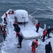 Coast Guard crew breaks ice on deck