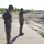 Surveying the future site of the Camp Dodge soccer field near the Freedom Center