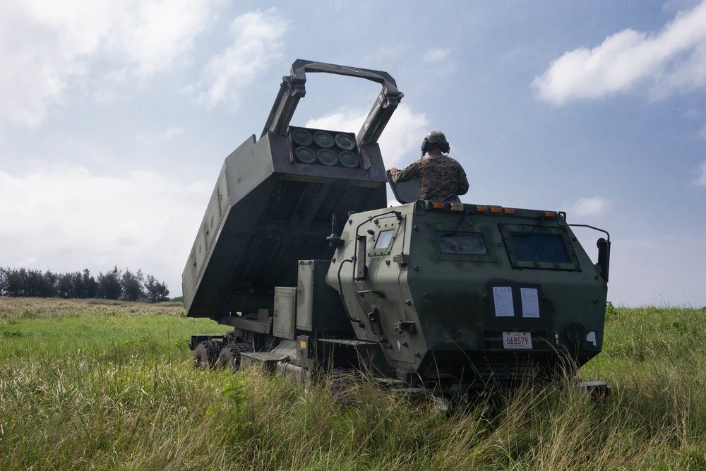 Extending the range: Marines secure martime terrain, deploy rocket system.