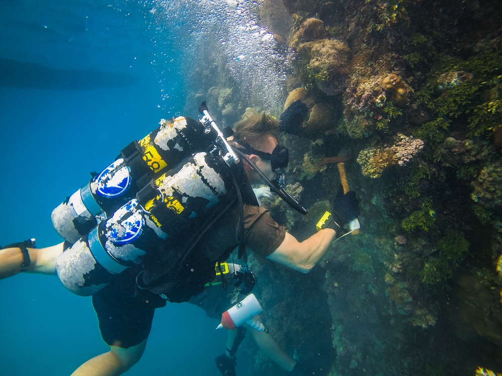 Navy Seabee Divers Inspect Pier in CNMI