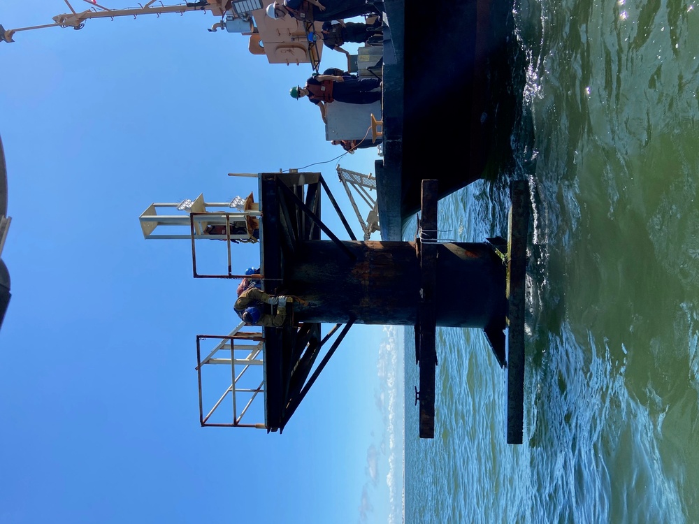 Coast Guard aids to navigation crew members repair navigation lights in Mobile, Alabama Channel