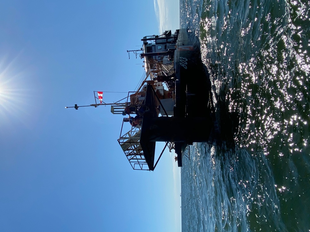 Coast Guard aids to navigation crew members repair navigation lights in Mobile, Alabama Channel