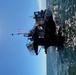 Coast Guard aids to navigation crew members repair navigation lights in Mobile, Alabama Channel