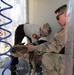 Dog tags and wags: Soldiers decontaminate search and rescue volunteers near North Complex Fire