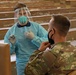 NMRTC-PH Sailor explains COVID-19 swab procedure to U.S. Army Soldier