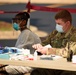 Michigan National Guard soldiers work side-by-side with members of the Wayne County Health Department