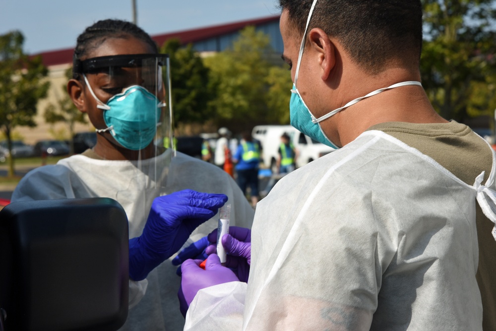 Michigan National Guard soldiers work side-by-side with members of the Wayne County Health Department