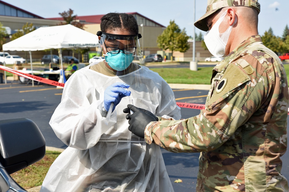 Michigan National Guard soldiers work side-by-side with members of the Wayne County Health Department