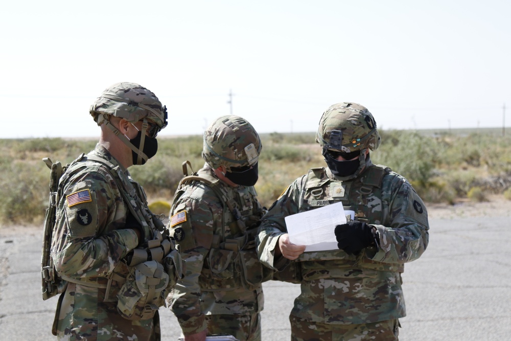 1-113th Soldiers move by Blackhawk