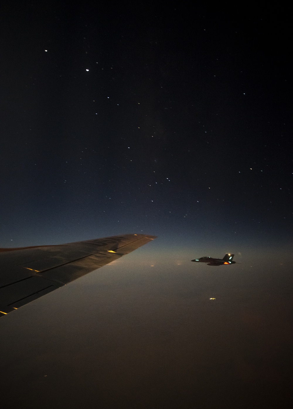 KC-135 refuels F/A-18s in support of Operation Inherent Resolve