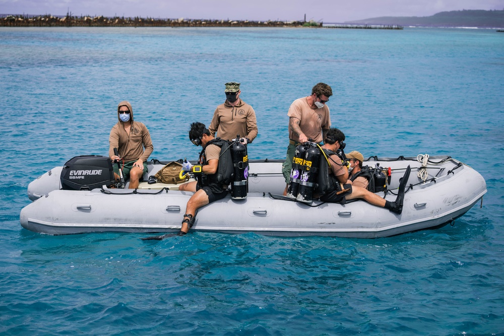 Navy Seabee Divers Inspect Pier in CNMI