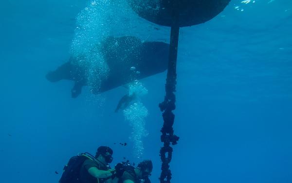 Navy Seabee Divers Inspect Pier in CNMI