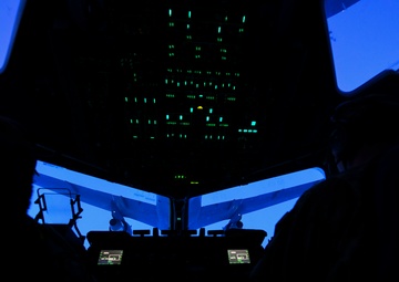 A C-17 Globemaster III aircraft conducts air-to-air refuel operations with a KC-46 Pegasus