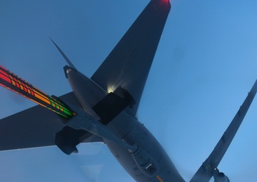 A KC-46 Pegasus aircraft conducts air-to-air refuel operations with a C-17 Globemaster III