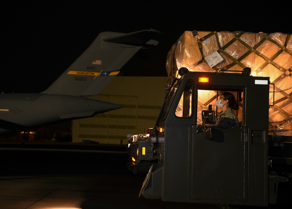 Senior Airman Ayumi Hullon-loads a mobile field hospital onto a C-17