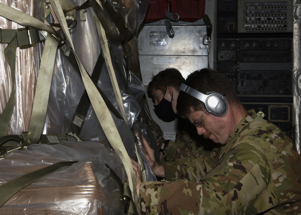 TSgt Robert Maynard off-loads a mobile field hospital from a C-17