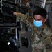 Airman First Class Virgilio Frial off-loads a mobile field hospital from a C-17