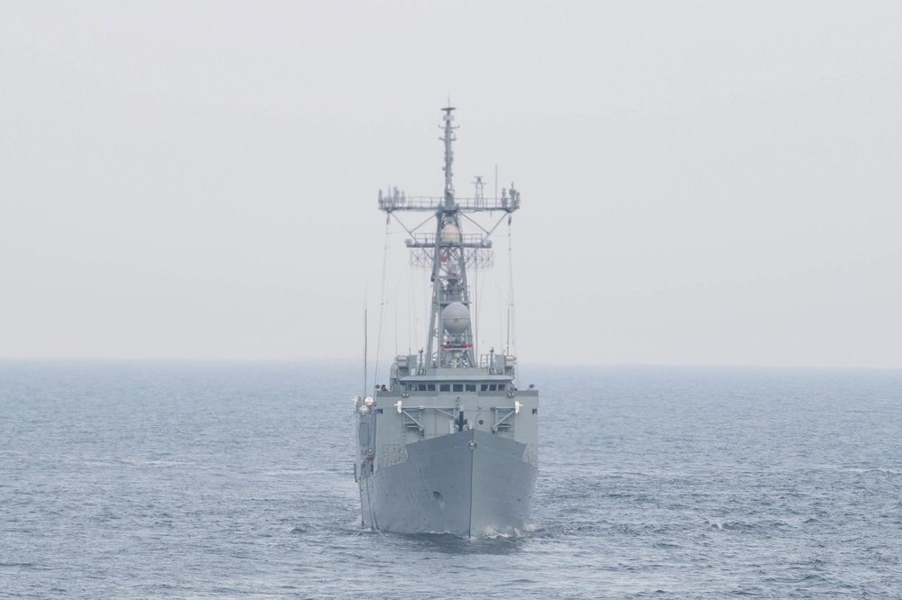 USS Ross (DDG 71) completes a passing exercise with Polish Navy.