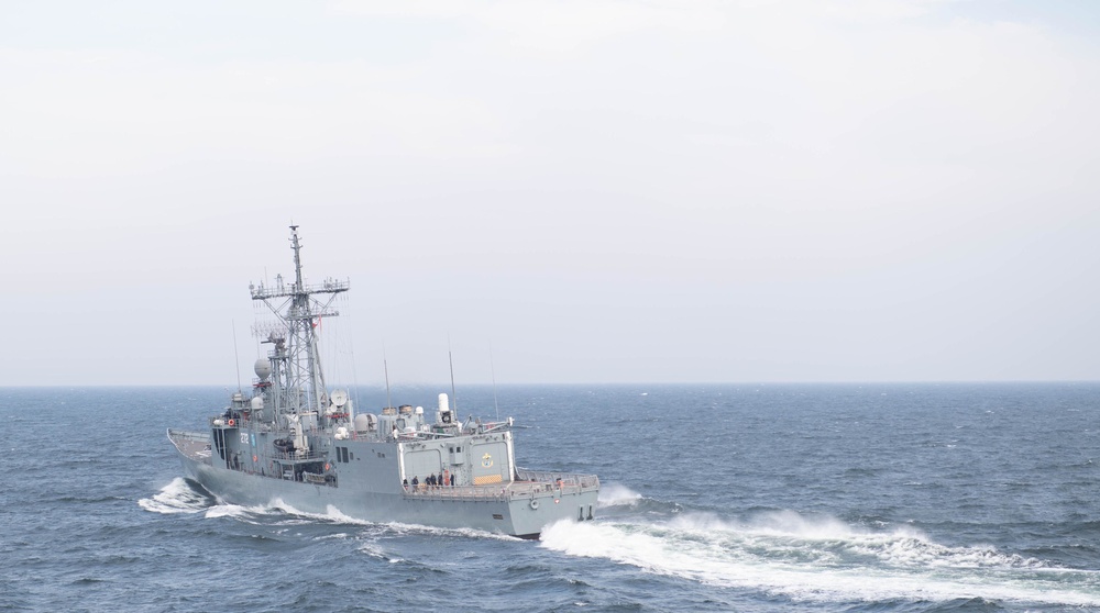 USS Ross (DDG 71) completes a passing exercise with polish Navy.