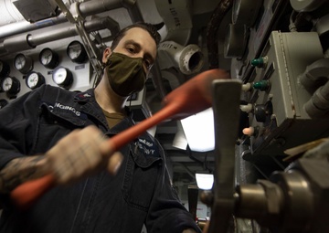 Sailor Adjusts Air Purification Unit Valve
