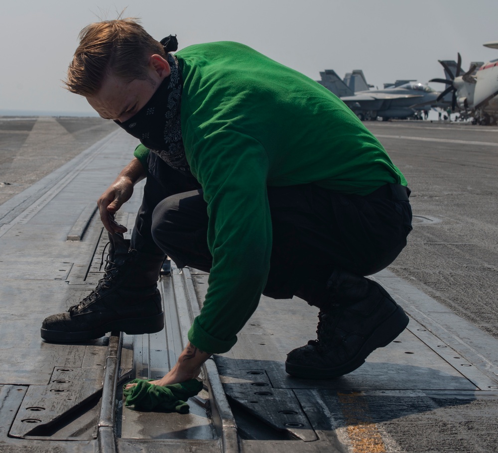 Sailor Performs Maintenance